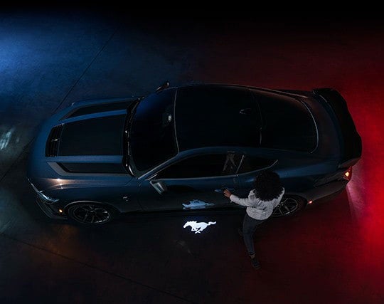 2024 Ford Mustang® Dark Horse™ model with a driver approaching the vehicle | Bird Kultgen Ford in Waco TX