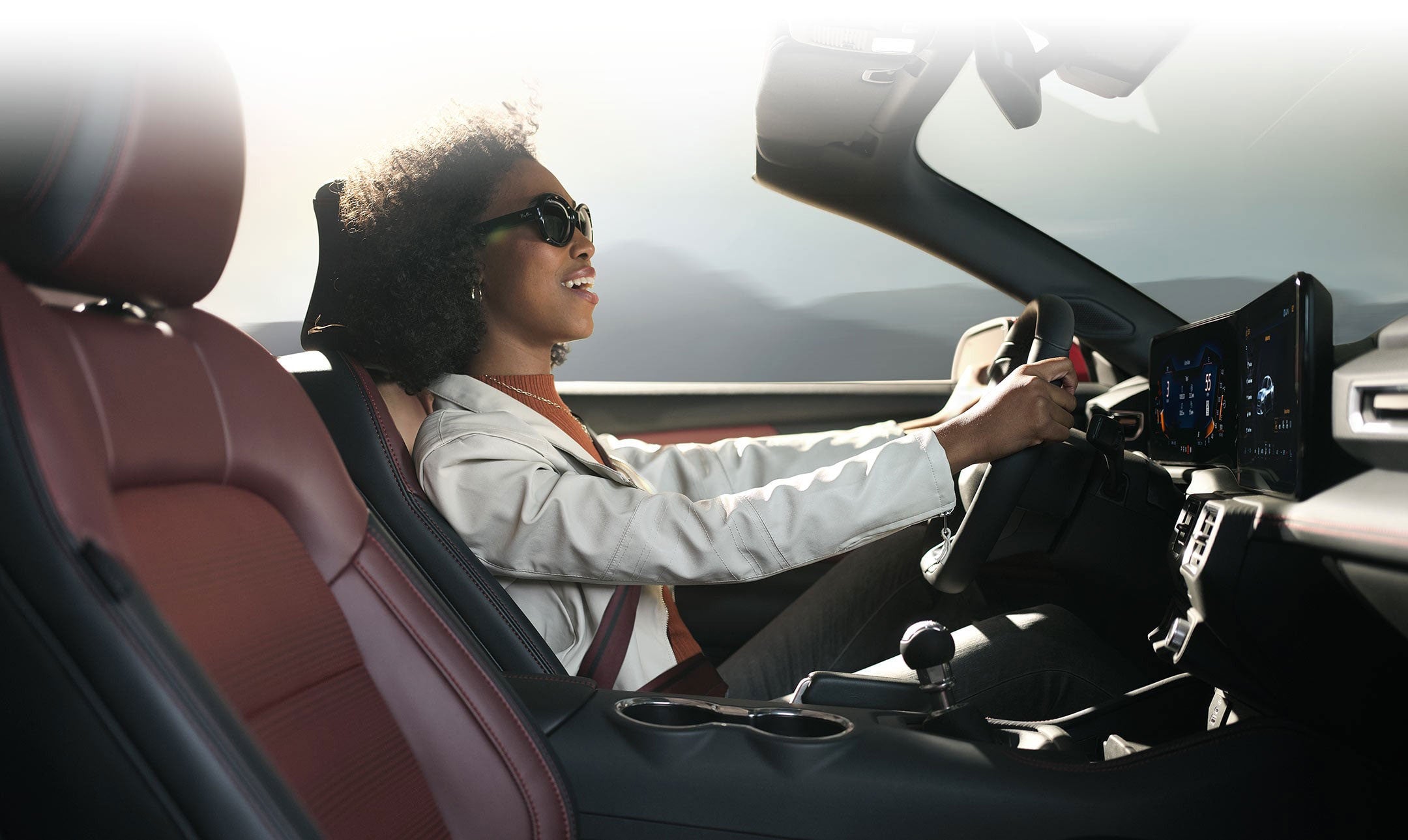 Person sitting in the driver’s seat of a 2024 Ford Mustang® convertible | Bird Kultgen Ford in Waco TX