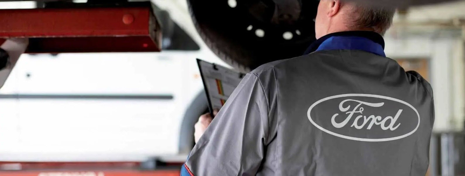 Ford Service technician working on a vehicle